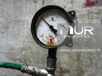 A pipe with pressure gauge of a central heating system of the residential buildings are seen, ahead the heating season, amid Russia's invasi...