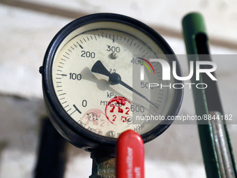 A pipe with pressure gauge of a central heating system of the residential buildings are seen, ahead the heating season, amid Russia's invasi...