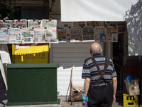 A man is looking newspapers on a kiosk in the center of Athens, Greece on September 14, 2022. (