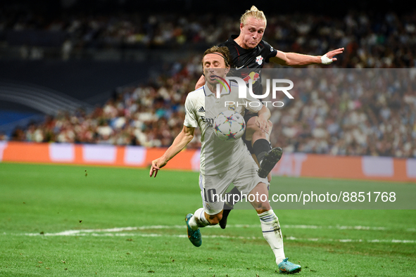 Luka Modric and Xaver Schlager during UEFA Champions League match between Real Madrid and RB Leipzig at Estadio Santiago Bernabeu on Septemb...