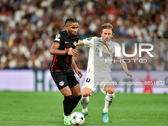 Christopher Nkunku and Luka Modric during UEFA Champions League match between Real Madrid and RB Leipzig at Estadio Santiago Bernabeu on Sep...
