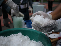 The Indonesian Navy is seen destroying evidence of methamphetamine weighing 23.98 Kilograms using a blender after being mixed with water and...