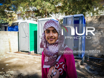A child in Leros Refugee Camp, on October 30, 2015. Refugee camp Leros, located on the Greek Island of Leros is a transit camp for refugees...