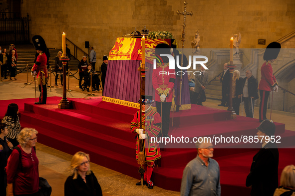Members of the public pay their respects as they pass the coffin of Queen Elizabeth II, lying in state on the catafalque in Westminster Hall...