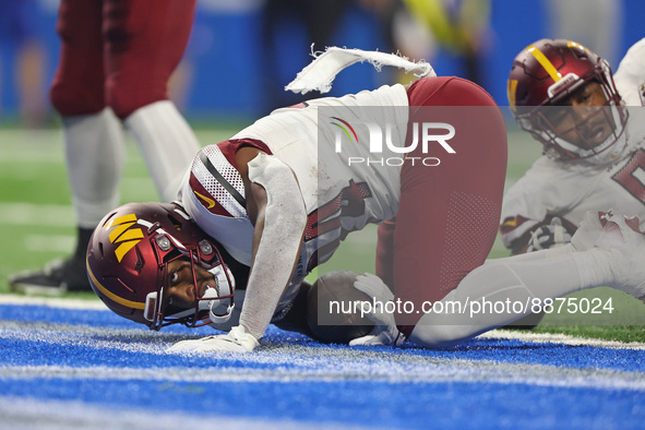 Washington Commanders running back Antonio Gibson (24) scores a touchdown during the second half of an NFL football game against the Detroit...