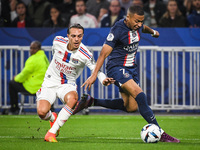 Maxence CAQUERET of Lyon and Kylian MBAPPE of PSG during the French championship Ligue 1 football match between Olympique Lyonnais and Paris...