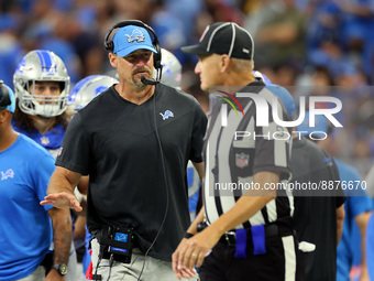 Head coach Dan Campbell of the Detroit Lions talks with line judge Mark Perlman (9) during an NFL football game between the Detroit Lions an...