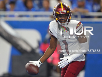Washington Commanders wide receiver Jahan Dotson (1) scores a touchdown during the second half of an NFL football game against the Detroit L...