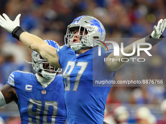 Defensive end Aidan Hutchinson (97) of the Detroit Lions reacts after sacking Washington Defenders quarterback Carson Wentz during an NFL fo...