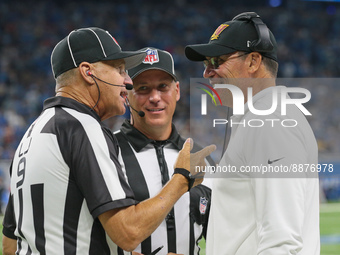Washington Commanders head coach Ron Rivera talks to line judge Mark Perlman (9) during the second half of an NFL football game between the...