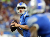 Quarterback Jared Goff (16) of the Detroit Lions prepares to pass the ball to wide receiver Josh Reynolds (8) of the Detroit Lions during an...