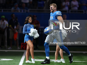 Detroit Lions defensive end Aidan Hutchinson (97) is introduced at the beginning of an NFL football game between the Washington Commanders a...