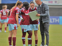 Paul Konchesky manager of West Ham United Women   having words with Lisa Evans (on loan from Arsenal) of West Ham United WFC, Viviana Asseyi...