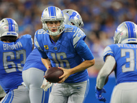 Quarterback Jared Goff (16) of the Detroit Lions looks to hand off the ball during an NFL football game between the Detroit Lions and the Wa...