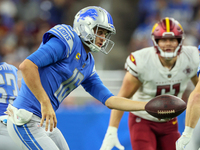 Quarterback Jared Goff (16) of the Detroit Lions goes to hand off the ball during an NFL football game between the Detroit Lions and the Was...