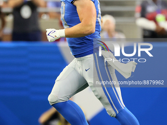 Tight end T.J. Hockenson (88) of the Detroit Lions runs off the field after a play during an NFL football game between the Detroit Lions and...