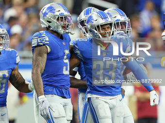 Safety DeShon Elliott (5) of the Detroit Lions is congratulated by safety JuJu Hughes (33) of the Detroit Lions after a successful play duri...