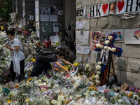 On September 19,2022, a woman places flower tributes outside of the British Consulate-General Hong Kong as the world reacts to the passing o...