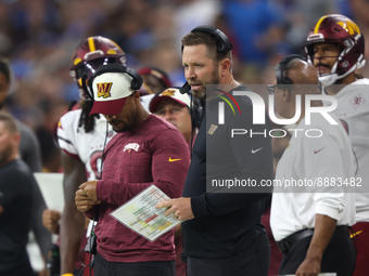 Washington Commanders offensive coordinator coach Scott Turner follows the play during the first half of an NFL football game against the De...
