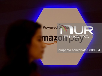 A woman walks past an Amazon Pay in Global Fintech Fest event in Mumbai, India, 20 September, 2022.  (