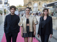 (L-R) Director and actor Louis Garrell; actress Noémie Merlant; and producer Anne-Dominique Toussaint, pose at the photocall for the film L'...