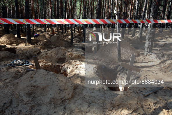 IZIUM, UKRAINE - SEPTEMBER 19, 2022 - The crosses are seen at the graves of Izium residents killed by Russian occupiers during exhumation pr...