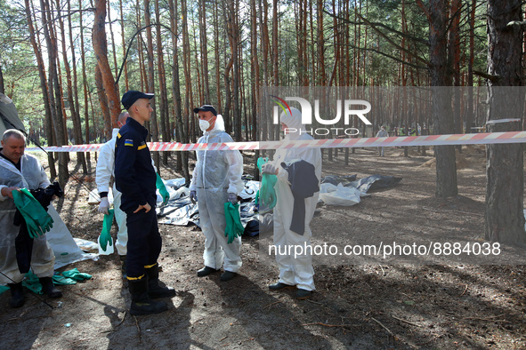 IZIUM, UKRAINE - SEPTEMBER 19, 2022 - The exhumation of the bodies of Izium residents tortured to death by Russian invaders is underway at a...