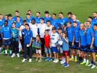 Players of Italy with children from the Bambin Gesu hospital before the training during the Other Press conference and Italy training sessio...