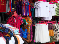 A vendor waits for customers at a market in Colombo on September 20, 2022. (