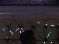 A man walks past a logo of  NPCI( National Payments Corporation of India) during the Global Fintech Fest in Mumbai, India, 20 September, 202...
