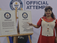  Clara Brugada, Mayor of Iztapalapa in Mexico City, displays Guinness World Record certificates for a massive boxing class, reading and the...