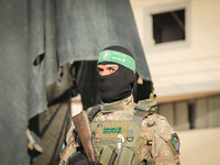 Members of the Izz al-Din al-Qassam Brigades, the military wing of the Islamic movement Hamas take part in inauguration ceremony of the 
