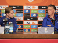 Netherlands player Frenkie de Jong (l) and coach Louis van Gaal (r) are seen during a press conference at the PGE National Stadium in Warsaw...