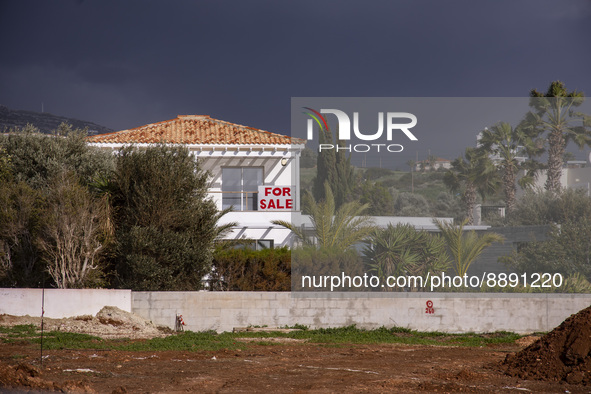 A house with a board reading 'On sale' on Cyprus on March 3, 2022. Cyprus has a special program called 'Golden Visa' granting permanent resi...