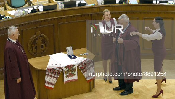 KYIV, UKRAINE - SEPTEMBER 21, 2022 - Judge Oleksandr Petryshyn puts on the robe in the presence of Acting Chief Justice of the Constitutiona...