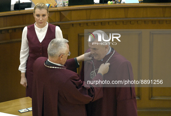 KYIV, UKRAINE - SEPTEMBER 21, 2022 - Acting Chief Justice of the Constitutional Court of Ukraine Serhiy Holovaty hands over the badge to Jud...