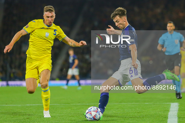 Kieran Tierney of Scotland National Team gets a cross in under pressure from Serhiy Sydorchuk of Ukraine during the UEFA Nations League matc...