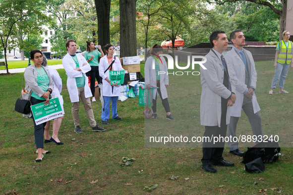 Medical professionals listen during a rally near the U.S. Capitol in Washington, D.C. on September 22, 2022 to urge the Senate to pass a fed...