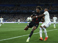 David Alaba centre-back of Real Madrid and Austria and Mohamed Simakan centre-back of RB Leipzig and France compete for the ball during the...