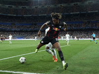 David Alaba centre-back of Real Madrid and Austria and Mohamed Simakan centre-back of RB Leipzig and France compete for the ball during the...