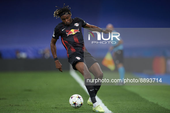 Mohamed Simakan centre-back of RB Leipzig and France controls the ball during the UEFA Champions League group F match between Real Madrid an...