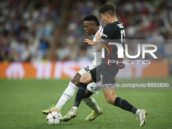 Vinicius Junior left winger of Real Madrid and Brazil in action and Dominik Szoboszlai attacking midfield of RB Leipzig and Hungary compete...