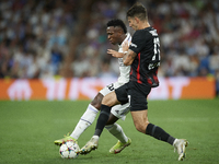 Vinicius Junior left winger of Real Madrid and Brazil in action and Dominik Szoboszlai attacking midfield of RB Leipzig and Hungary compete...