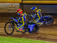 Adam Ellis  (Red) and Kyle Howarth  (Blue) go for maximum points during the SGB Premiership match between SheffieldTigers and Belle Vue Aces...