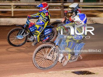 Tobiasz Musielak  (Red) and Lewis Kerr  (Blue) lead Matej Zagar (White) during the SGB Premiership match between Sheffield Tigers and Belle...