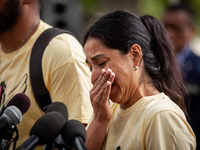 Kimberly Rubio pauses to compose herself while speaking about her daughter, Lexi, at a rally demanding the Senate pass an assault weapons ba...