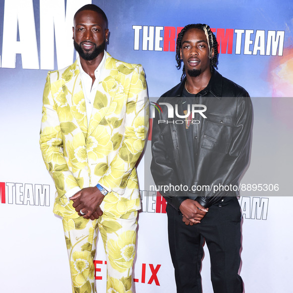 American former professional basketball player Dwyane Wade wearing Gucci and son/American professional basketball player Zaire Wade arrive a...