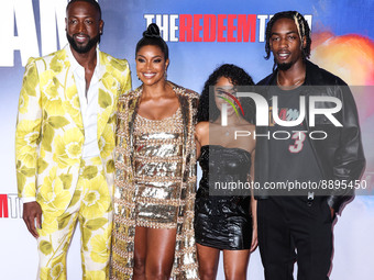 American former professional basketball player Dwyane Wade wearing Gucci, wife/American actress Gabrielle Union wearing Valentino, Lola Clar...