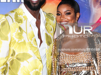 American former professional basketball player Dwyane Wade wearing Gucci and wife/American actress Gabrielle Union wearing Valentino arrive...