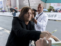 Actor Norman Reedus signs autographs upon his arrival at the San Sebastian Film Festival, at the Hotel Maria Cristina, on September 23, 2022...